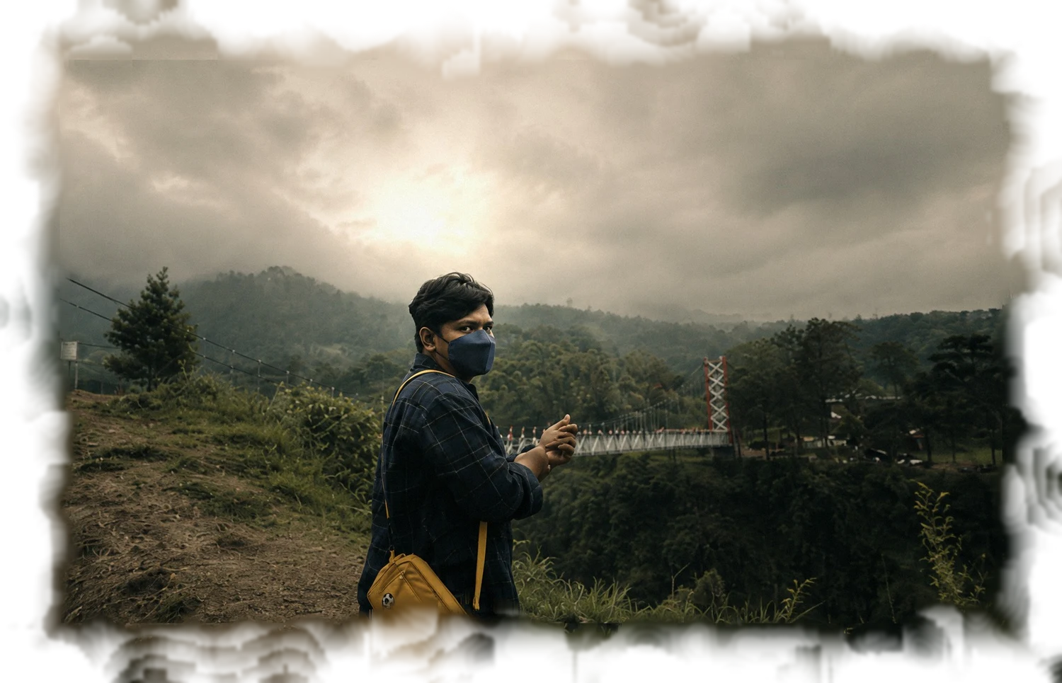 Engki at a misty valley overlook in Yogyakarta
