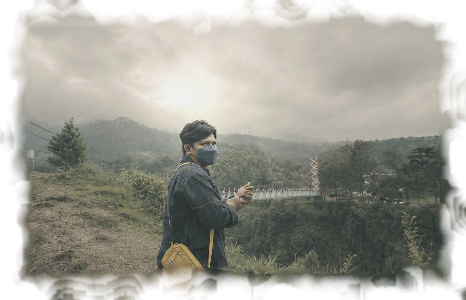 Engki at a misty valley overlook in Yogyakarta